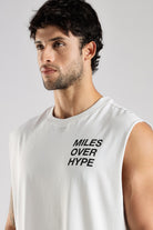 Close-up of the Miles Over Hype graphic on the white tank top