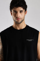 Close-up of the black Third Society tank top showing the Crew 24/7 chest branding