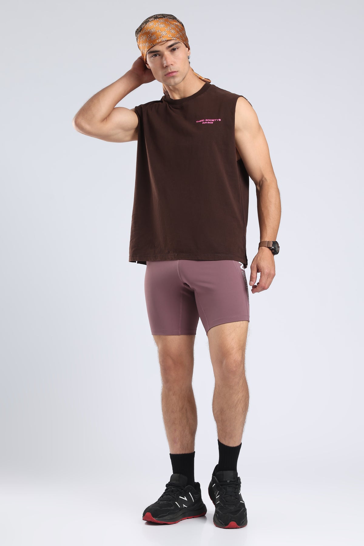 Model styling the Burnt Umber Wash tank with mauve shorts and a patterned bandana