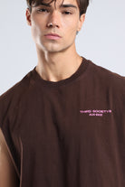 Close-up of the pink Third Society Run Base logo on the brown tank