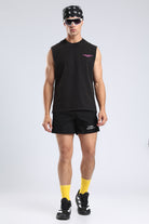 Model wearing the Carbon Wash tank with black shorts and yellow socks