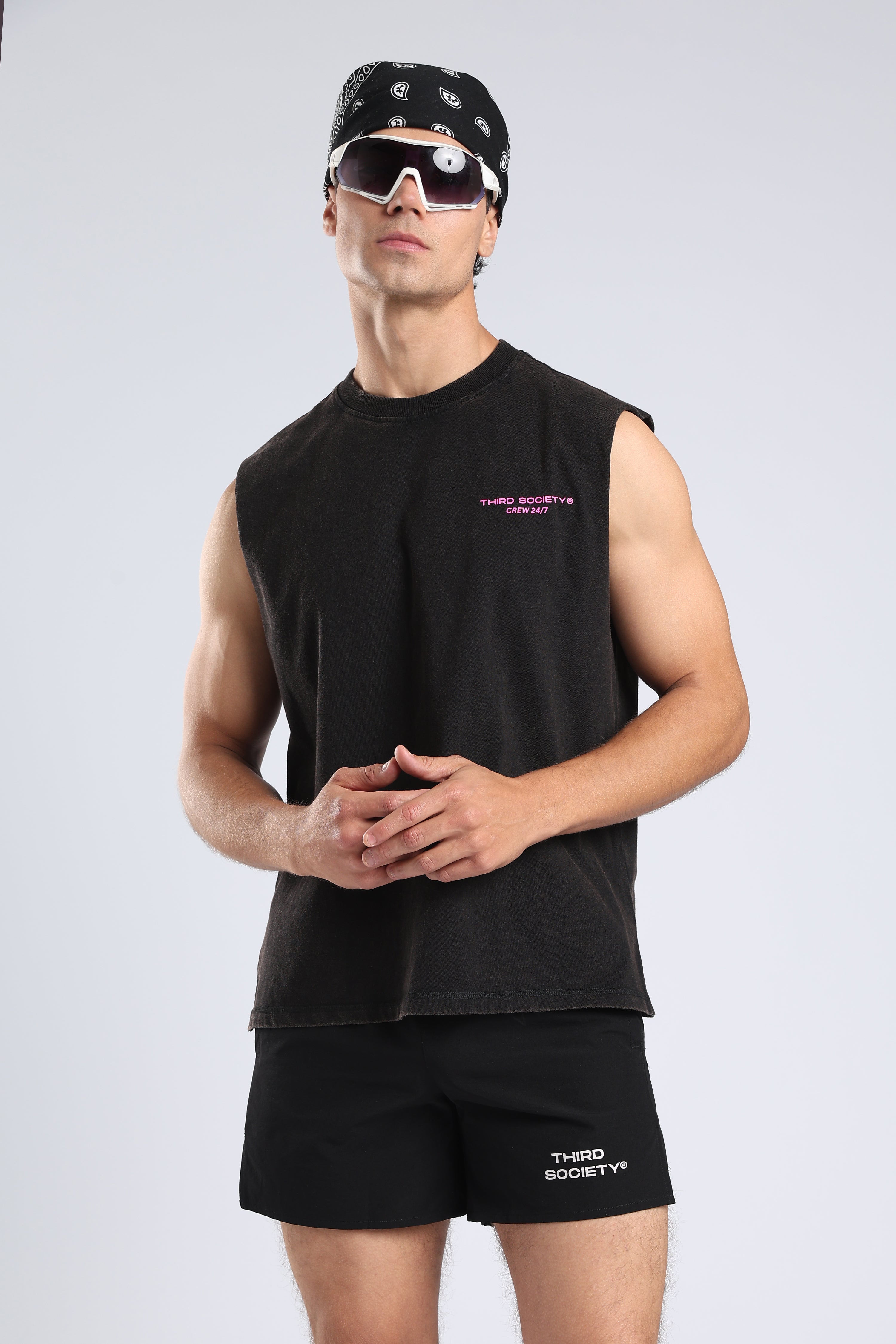 Full view of the Carbon Wash tank styled with black shorts and trainers