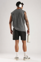 Back view of the model wearing the Grey Third Society oversized tank top