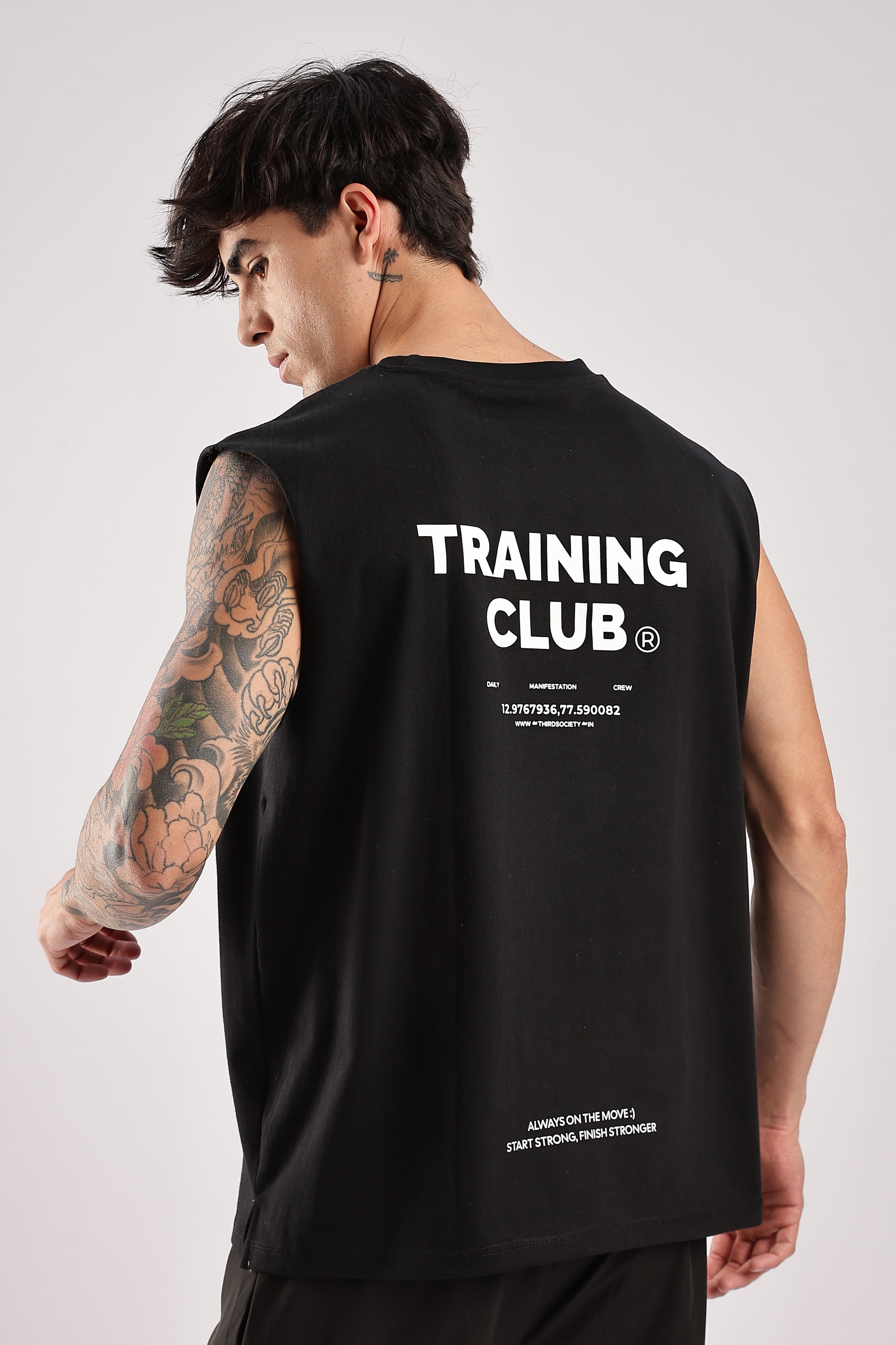 Training Club black tank top showing the back graphic and relaxed fit