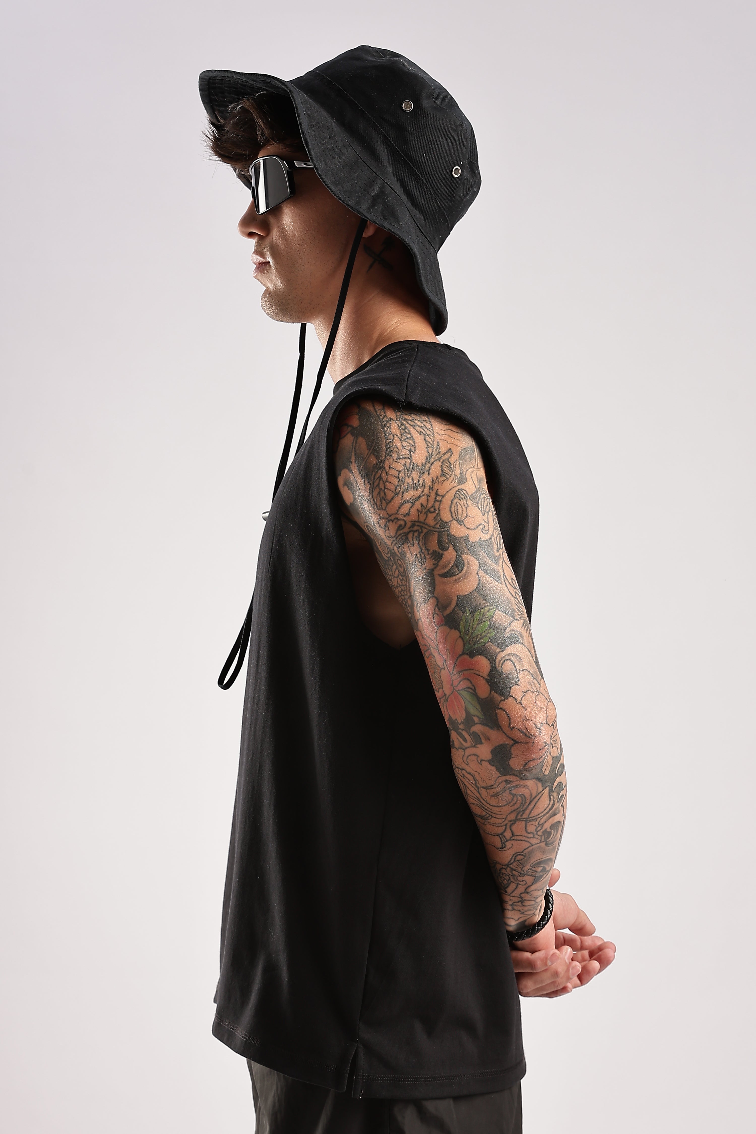 Side view of black men's tank top showing the sleeveless cut