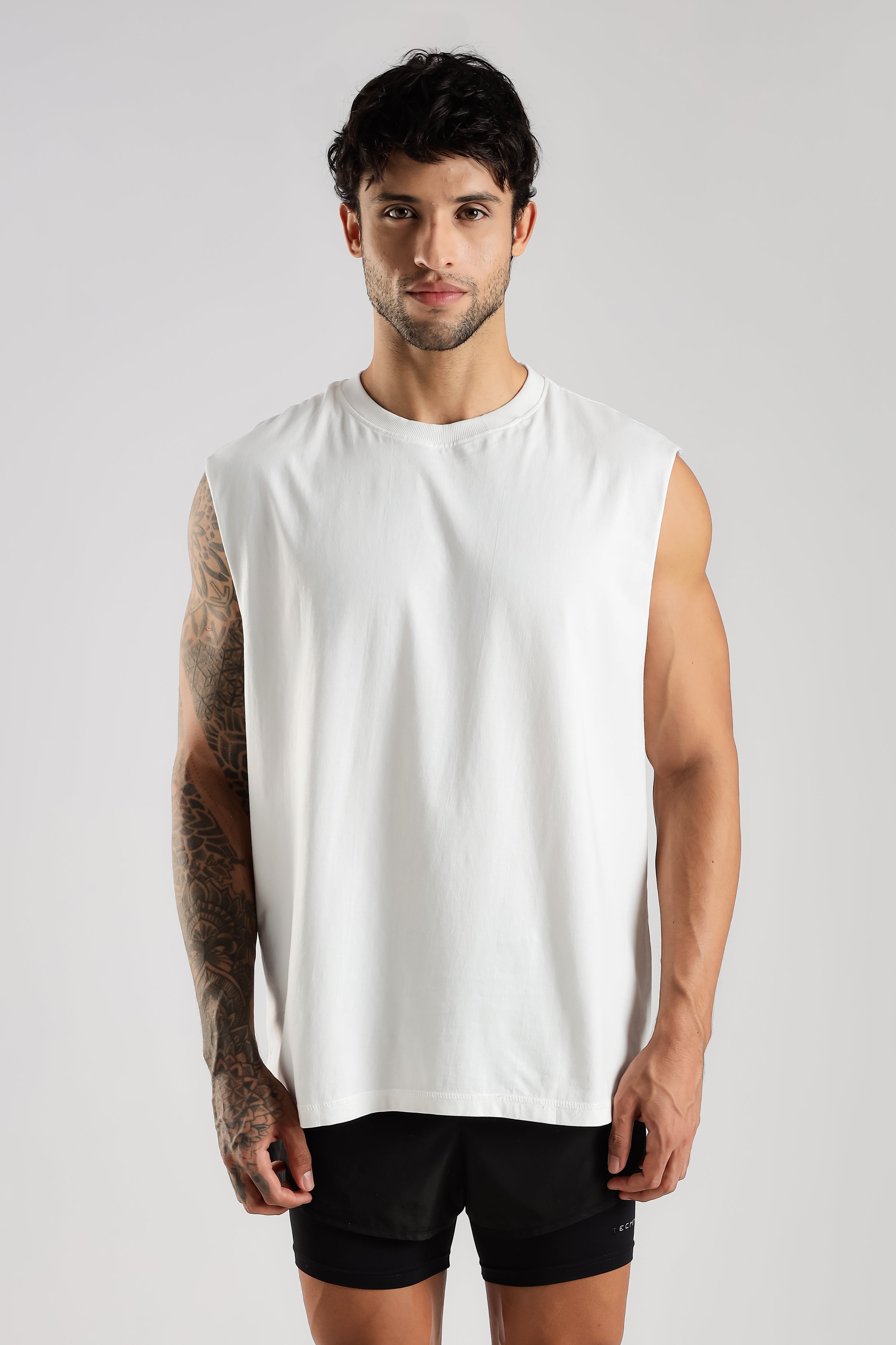Close-up front view of the white Training Club tank showing the oversized fit