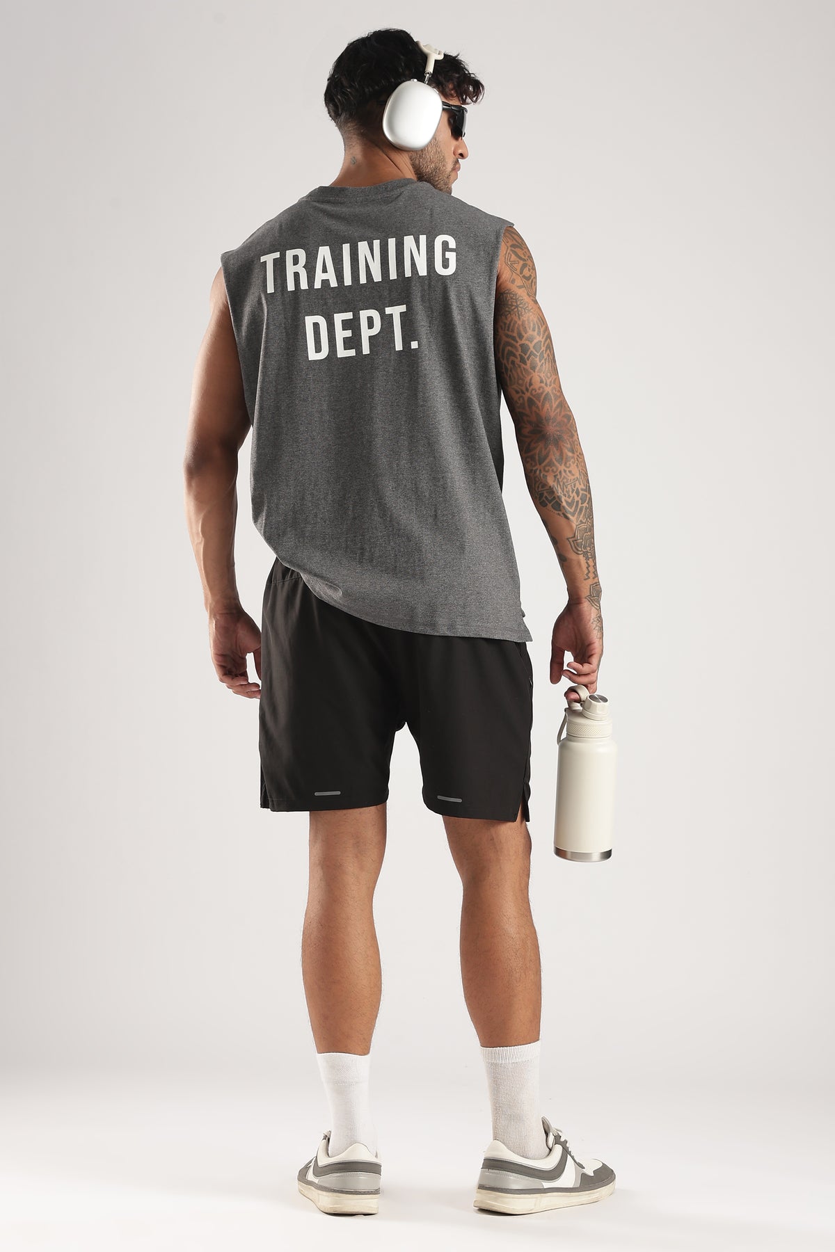 Model wearing the Grey Marl Training Dept tank showing the large Training Dept back graphic