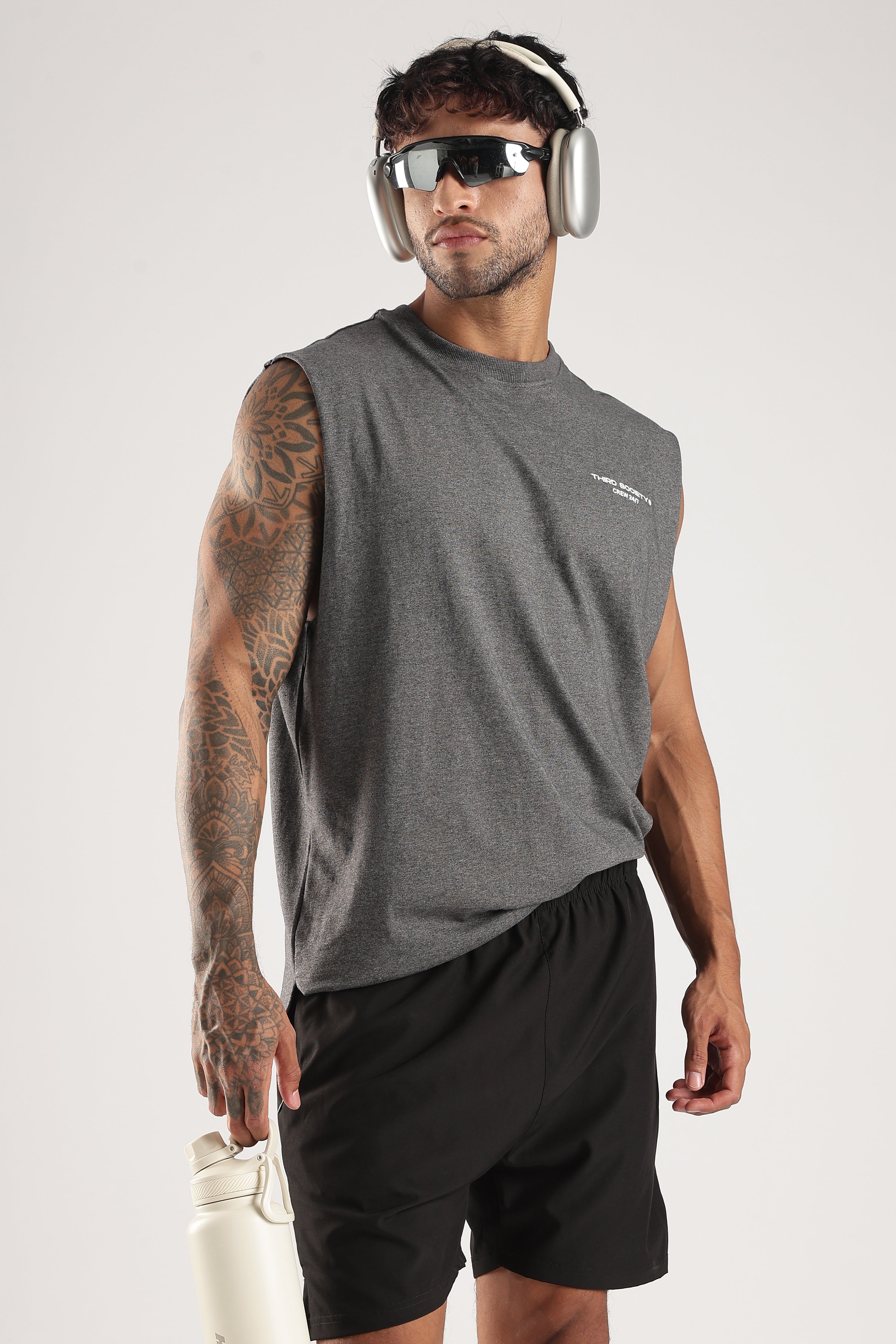 Model wearing the Grey Marl Training Dept tank with Third Society Crew 24/7 chest branding
