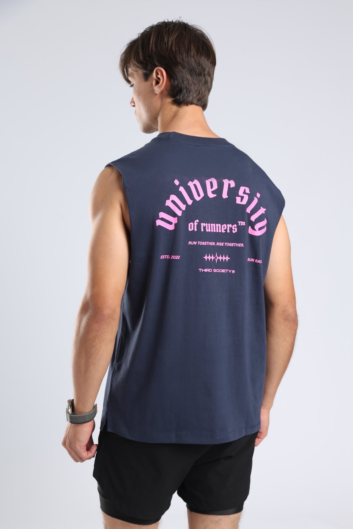 Close-up of the pink University of Runners graphic on the back of the Iron Blue tank