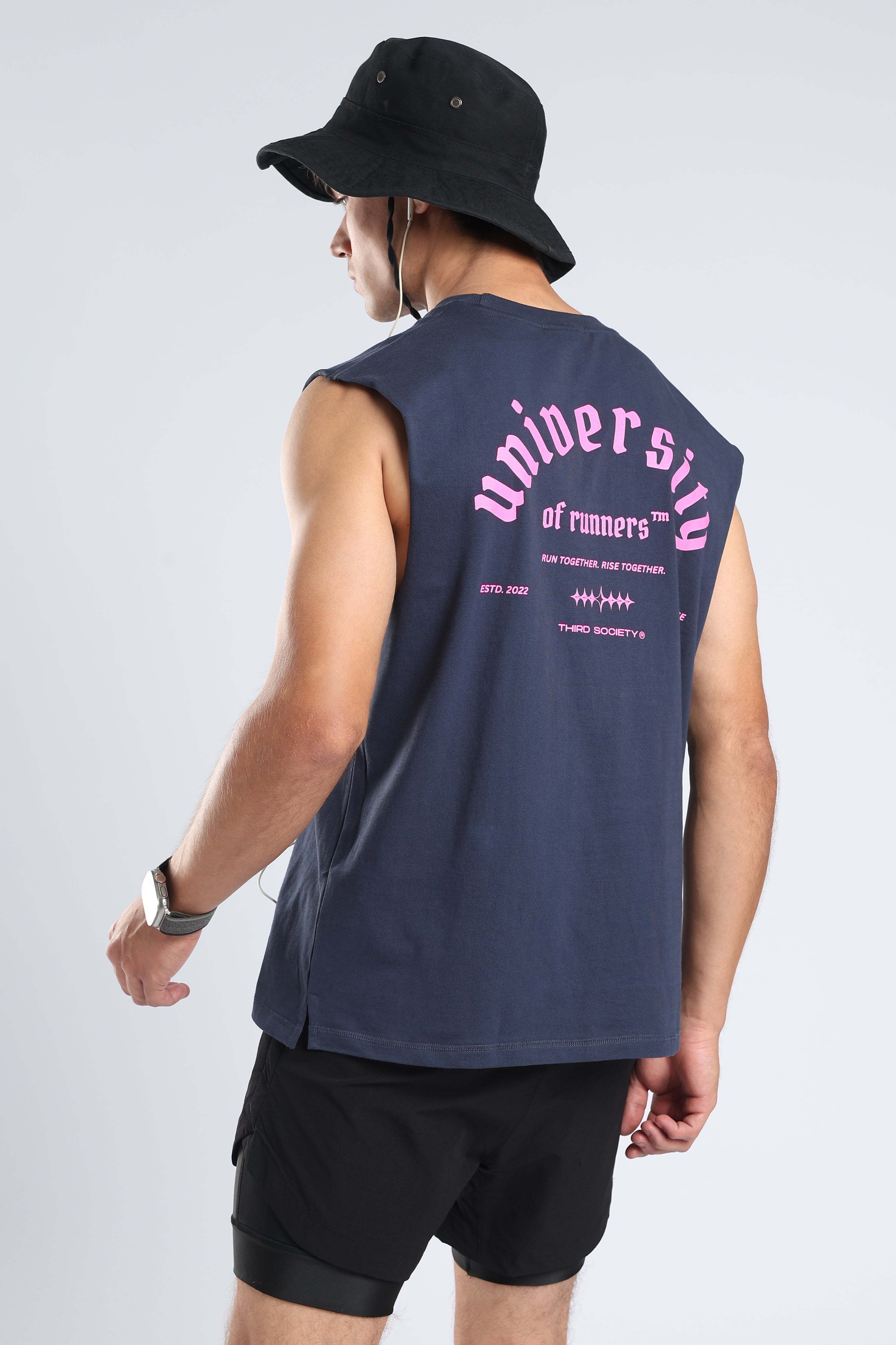 Model wearing the Iron Blue University of Runners tank with a large pink back graphic